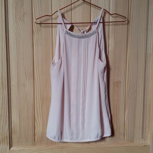 Express top adorned with pearls and gems